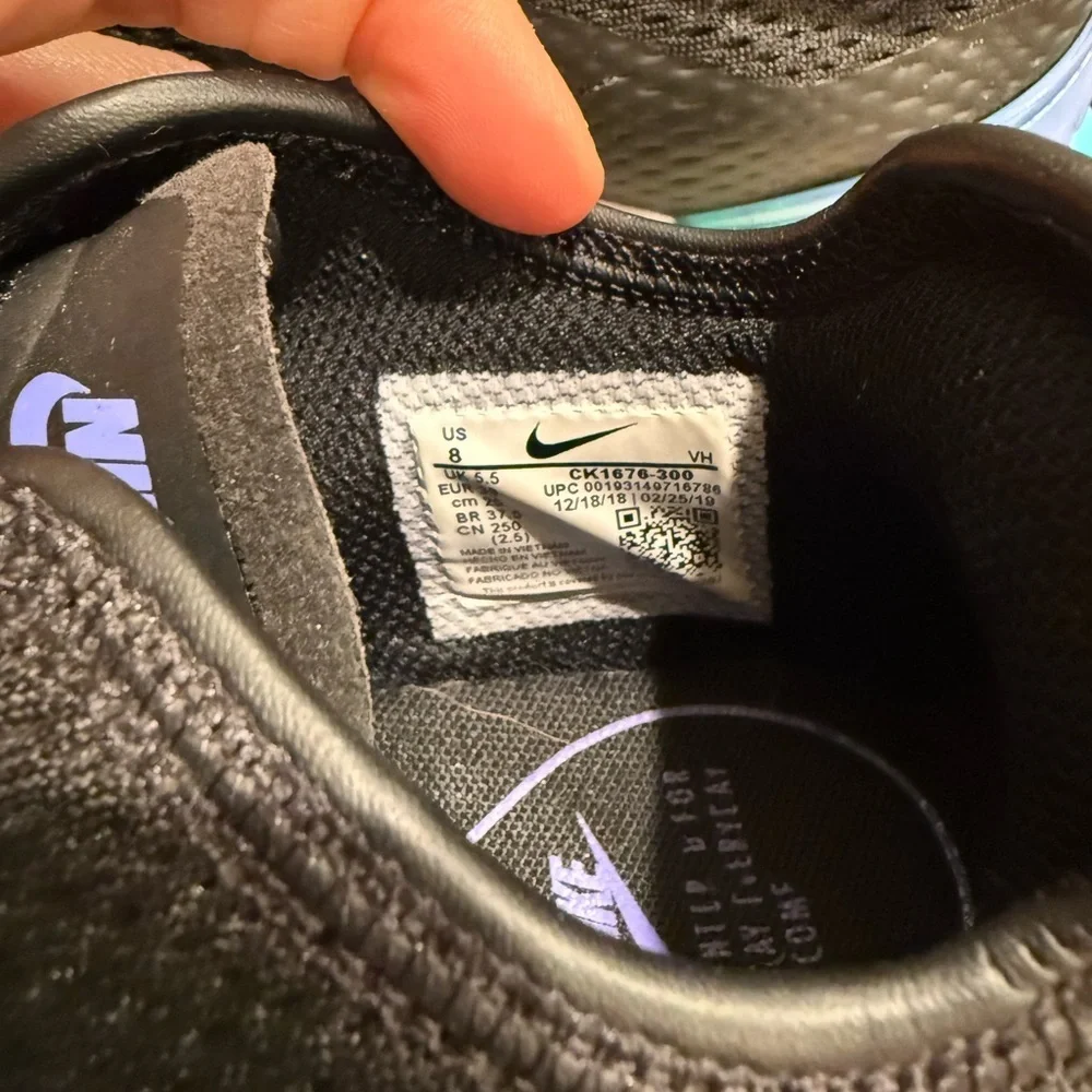 Nike Men's Black and Purple Sneakers with Teal Accents